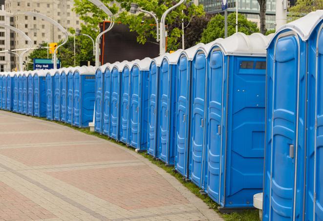 a row of portable restrooms at a fairground, offering visitors a clean and hassle-free experience in Deerfield